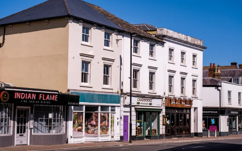 Mixed-use high street with shops below homes